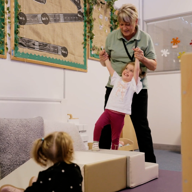 Nursery Room Leader working with children and colleagues at Tiny Toez